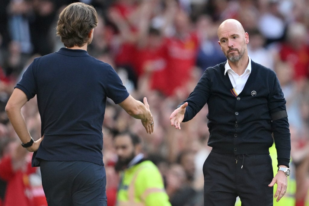 Thomas Frank, Manager of Brentford, and Erik ten Hag, Manager of Manchester United, communicate after the Premier League match between Manchester…