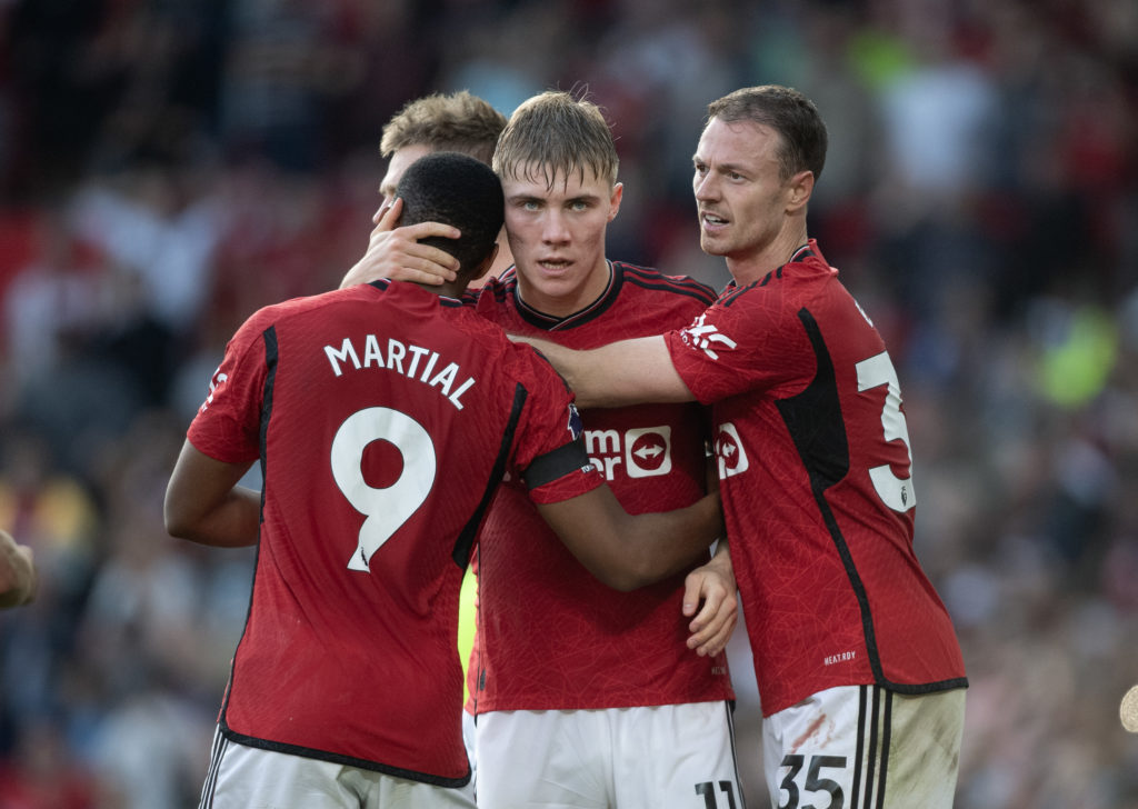 Rasmus Hojlund of Manchester United celebrates with team mates Anthony Martial and Jonny Evans after their team's winning goal during the Premier L...