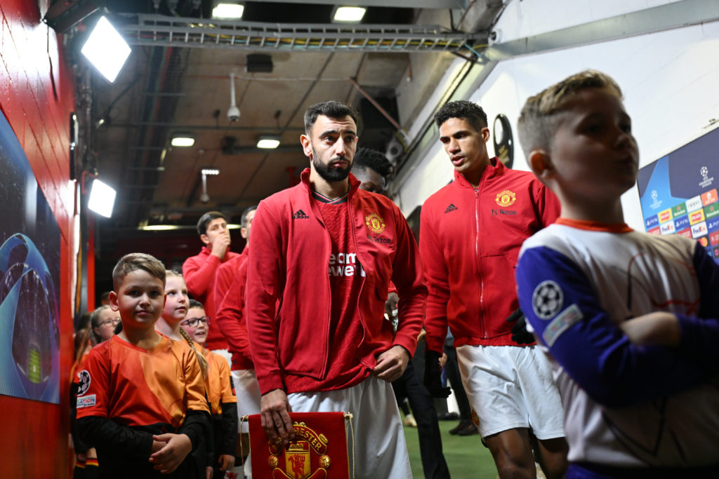 Raphael Varane of Manchester United speaks to Bruno Fernandes in the tunnel before the UEFA Champions League match between Manchester United and F....