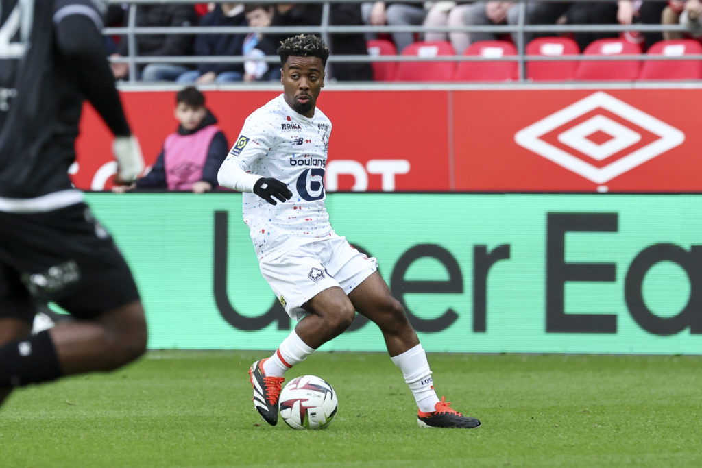 Angel Gomes #8 of Lille OSC controls the ball during the Uber Eats Ligue 1 match between Stade de Reims and Lille OSC at Stade Auguste Delaune on...