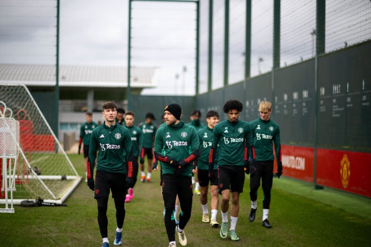 (EXCLUSIVE COVERAGE) Charlie McNeill, Christian Eriksen, Ethan Williams of Manchester United in action during a first team training session at Carr...