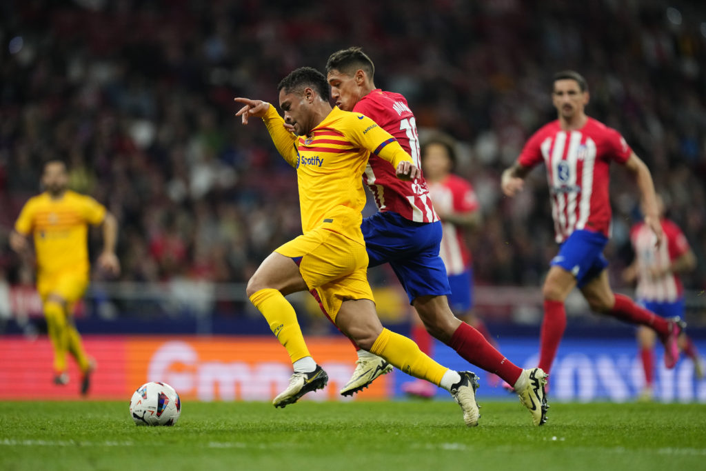 Vitor Roque center forward of Barcelona and Brazil and Nahuel Molina right back of Atletico de Madrid and Argentina compete for the ball during the...