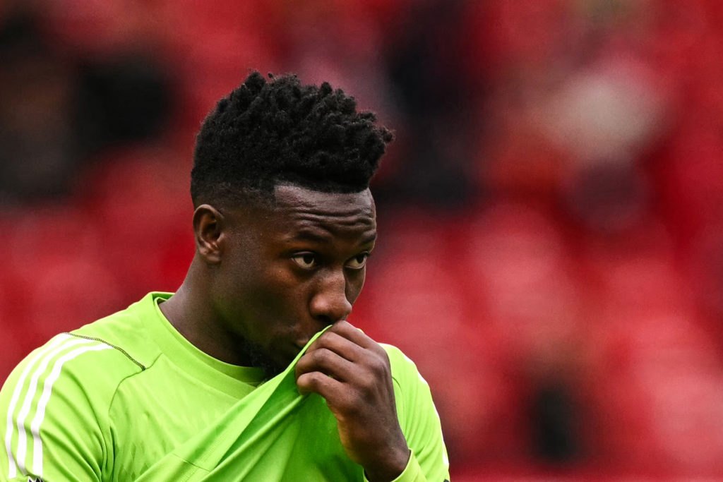 Manchester United's Cameroonian goalkeeper #24 Andre Onana reacts at the end of the English Premier League football match between Manchester United...