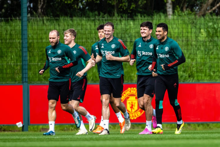 Christian Eriksen, Rasmus Hojlund, Ethan Wheatley, Jonny Evans, Harry Maguire and Casemiro of Manchester United in action during a first team train...