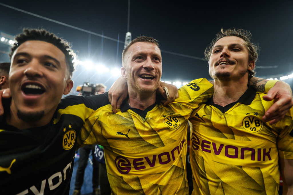 Borussia Dortmund's Jadon Sancho (left), Borussia Dortmund's Marco Reus (center) and Borussia Dortmund's Marcel Sabitzer (right) celebrate after the...