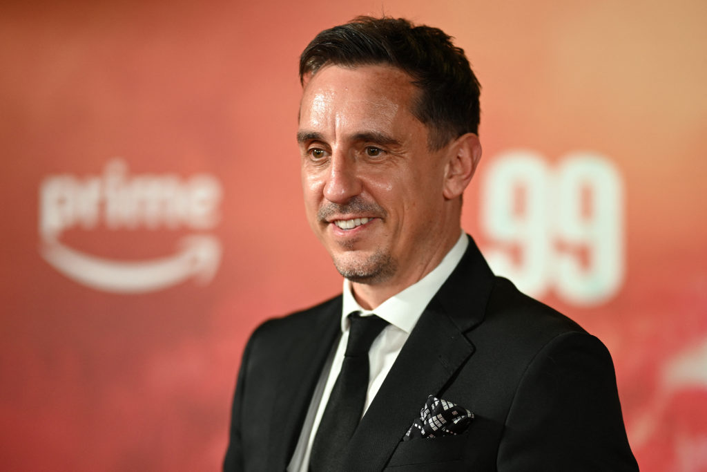Former Manchester United footballer Gary Neville poses on the red carpet upon arrival to attend the world premiere of the documentary '99', in Manc...