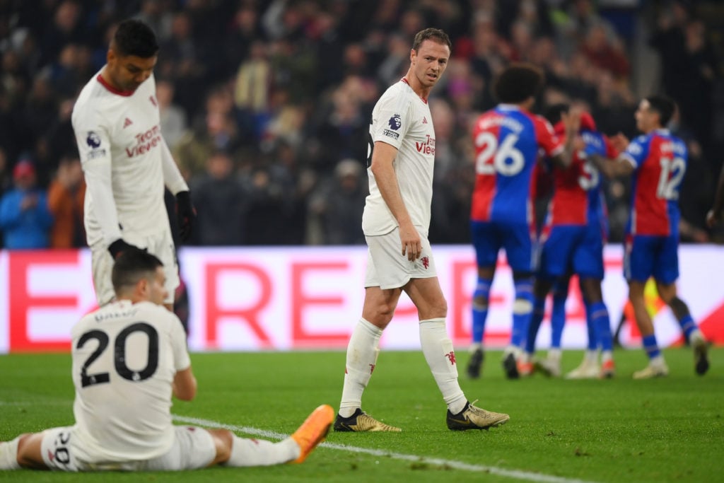 Manchester United's Jonny Evans looks dejected as he looks back at Casemiro and Diogo Dalot after Crystal Palace's Tyrick Mitchell (not pictured...