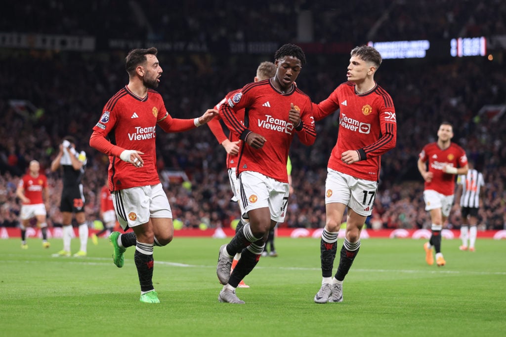 Kobbie Mainoo of Manchester United (C) celebrates with Alejandro Garnacho of Manchester United (R) and Bruno Fernandes of Manchester United (L) aft...