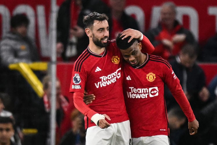 Manchester United's Ivorian midfielder #16 Amad Diallo (R) celebrates with Manchester United's Portuguese midfielder #08 Bruno Fernandes (L) after ...