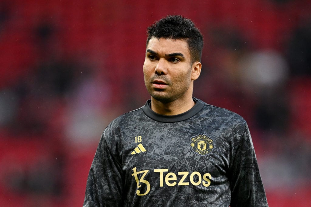 Manchester United's Casemiro warms up before the Premier League match between Manchester United and Newcastle United at Old Trafford on May 15, ...