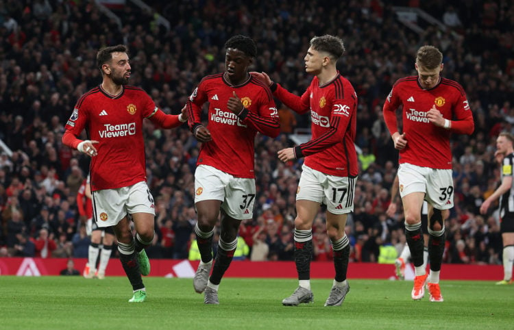 Kobbie Mainoo of Manchester United celebrates scoring their first goal during the Premier League match between Manchester United and Newcastle Unit...