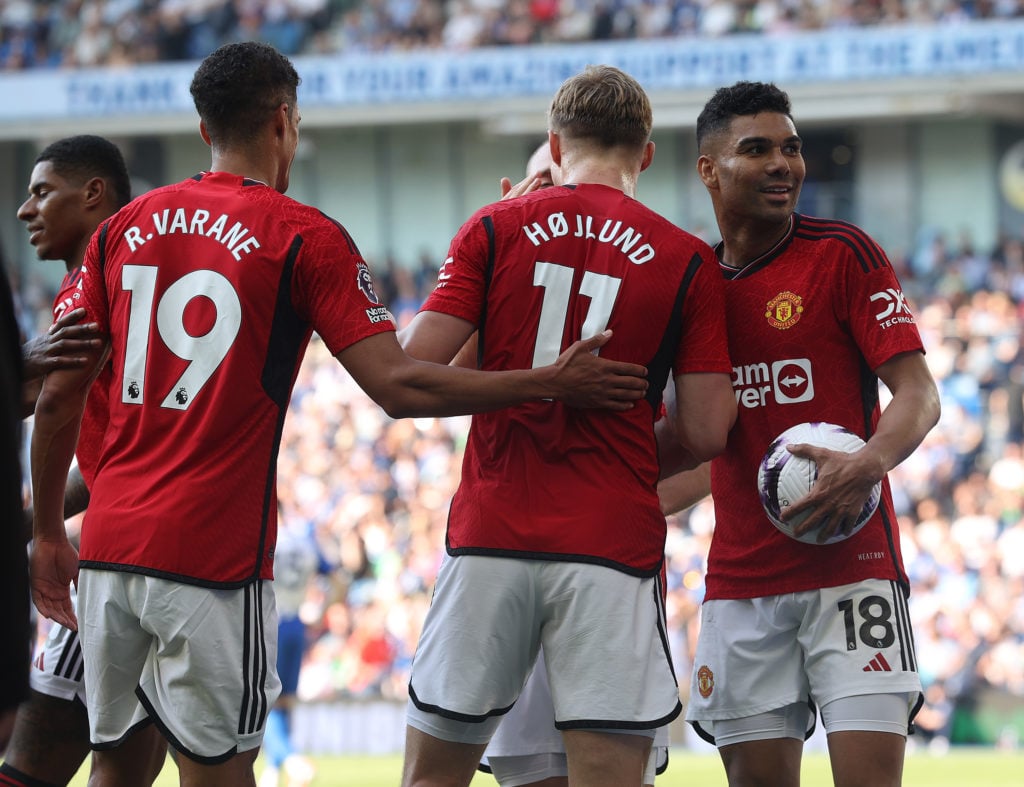Casemiro of Manchester United celebrates Rasmus Hojlund scoring their second goal during the Premier League match between Brighton & Hove Albio...
