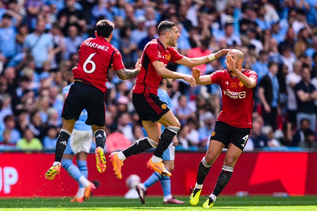 Diogo Dalot of Manchester United (C) celebrating Garnacho 's goal with his teammates during the Emirates FA Cup Final match between Manchester City...