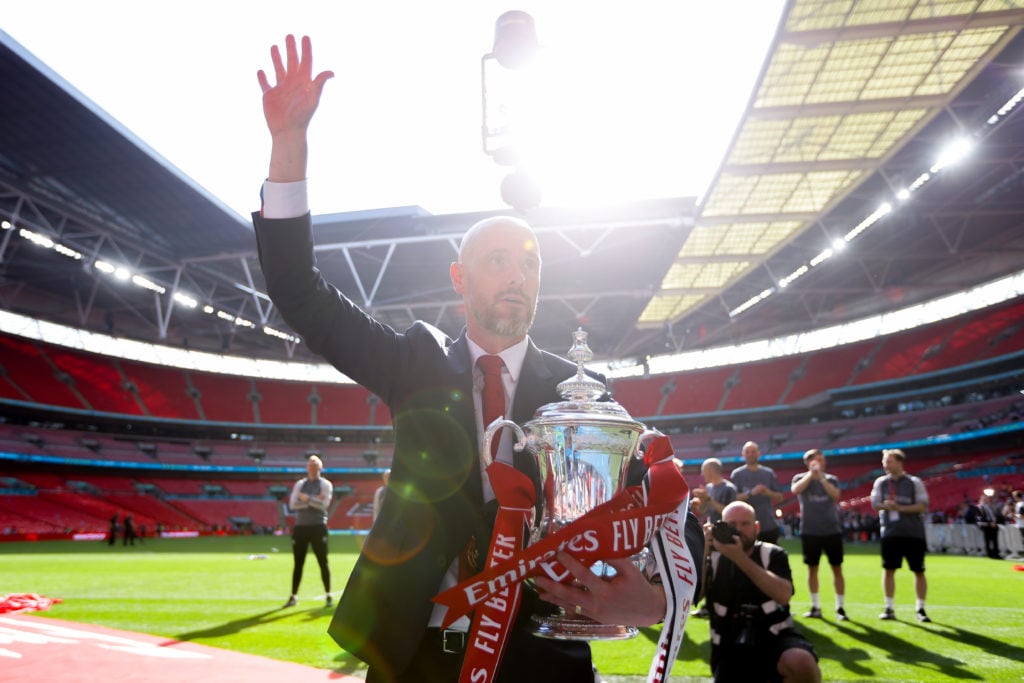 Manchester United manager Erik ten Hag celebrates with the FA Cup trophy during the Emirates FA Cup Final match between Manchester City and Manches...