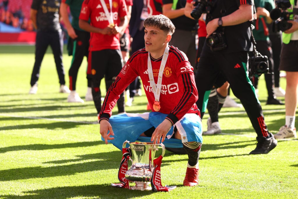 Alejandro Garnacho of Manchester United celebrates with the trophy following during the Emirates FA Cup Final match between Manchester City and Man...