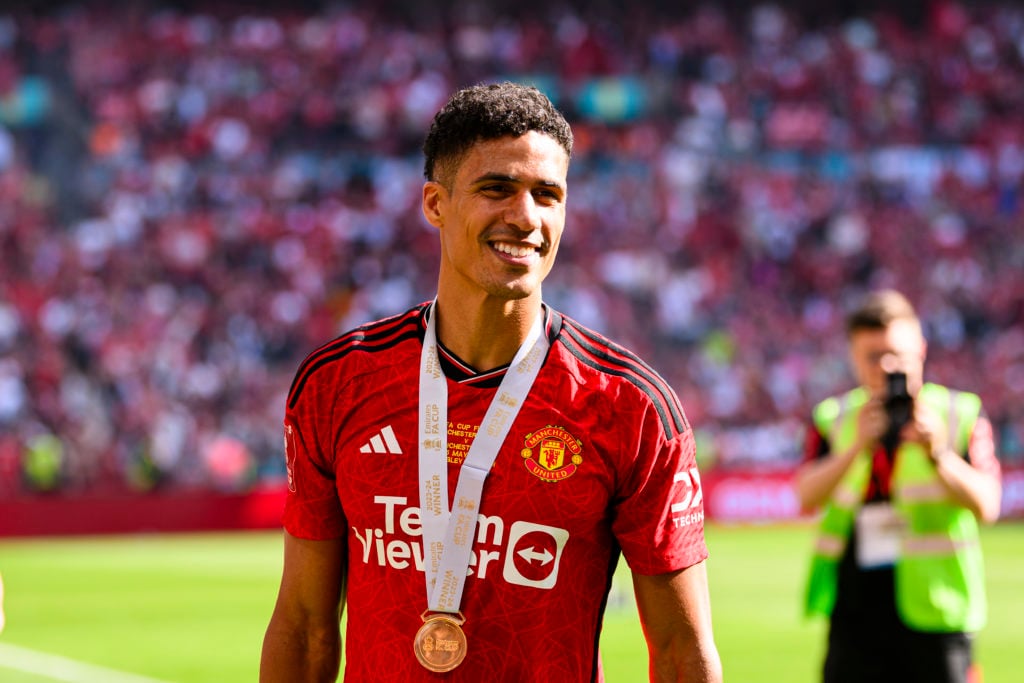 Manchester United's Raphael Varane celebrates with his teammates and fans after beating Manchester City during the Emirates FA Cup Final match...