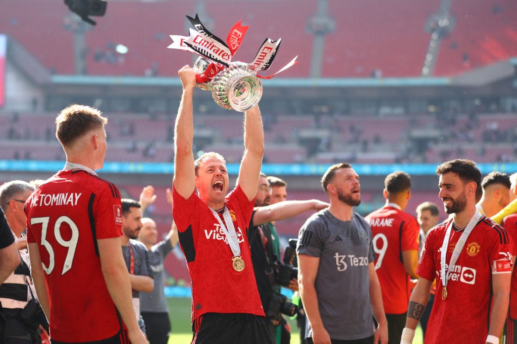 Jonny Evans of Manchester United celebrates with the FA Cup Trophy during the Emirates FA Cup Final match between Manchester City and Manchester Un...