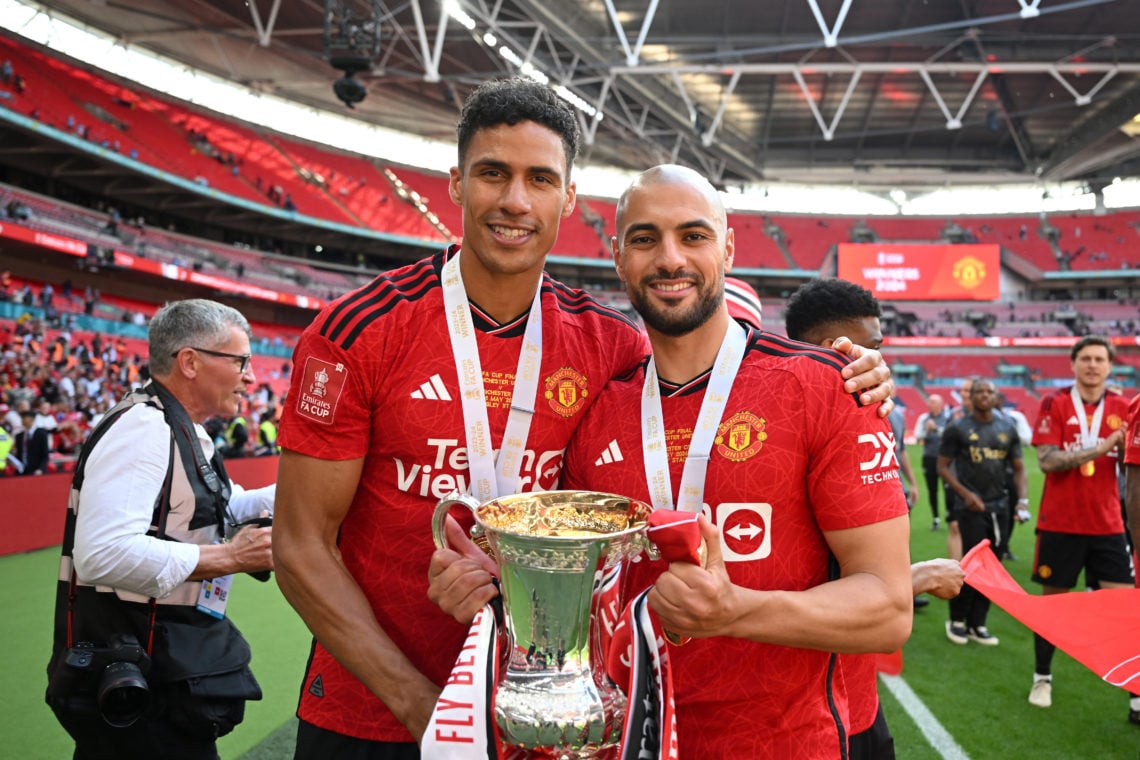 Raphael Varane and Sofyan Amrabat of Manchester United celebrates with the Emirates FA Cup Trophy after his team's victory after the Emirates FA Cu...