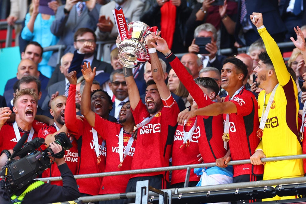 Bruno Fernandes of Manchester United lifts the trophy following the Emirates FA Cup Final match between Manchester City and Manchester United at We...