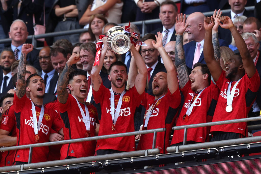 Mason Mount of Manchester United lifts the Emirates FA Cup Trophy after his team's victory in the Emirates FA Cup Final match between Manchester Ci...