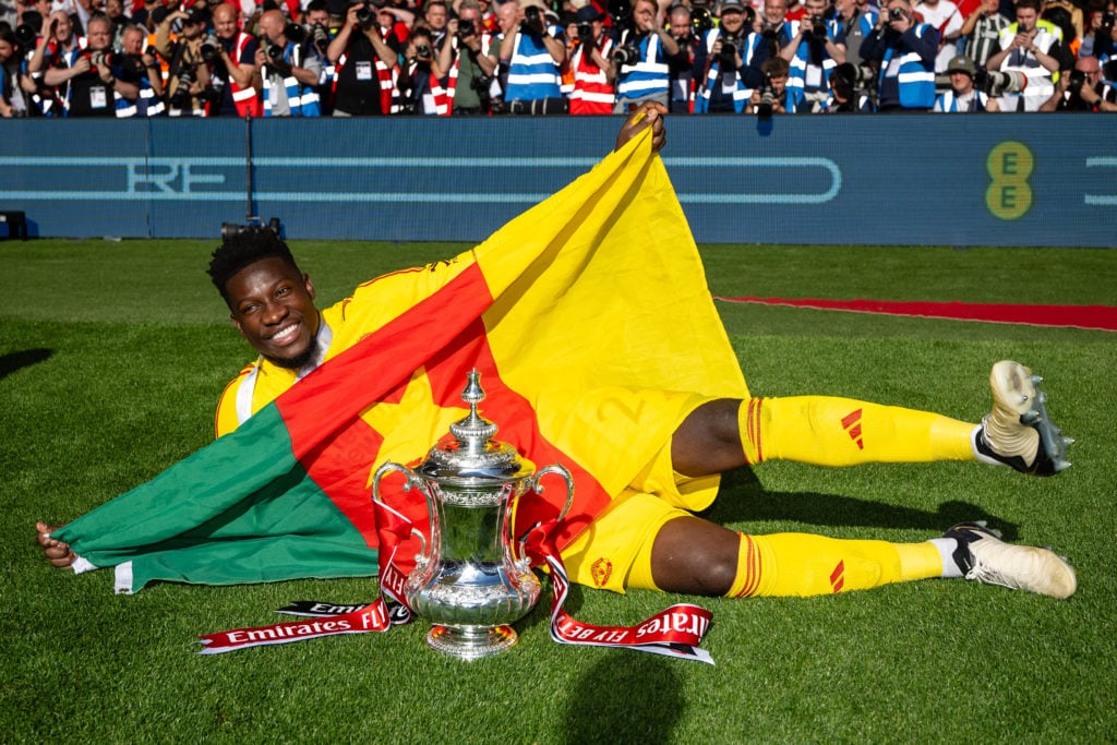 Andre Onana of Manchester United celebrates with the Emirates FA Cup trophy after winning the Emirates FA Cup Final match between Manchester City a...