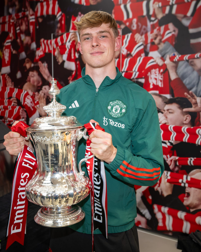 Manchester United's Toby Collyer celebrates in the dressing room with the Emirates FA Cup trophy after winning the Emirates FA Cup Final match bet...