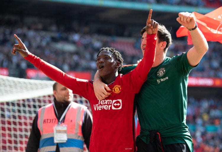 Kobbie Mainoo (left) and Harry McGuire of Manchester United celebrate winning the Emirates FA Cup Final match between Manchester City and Mancheste...