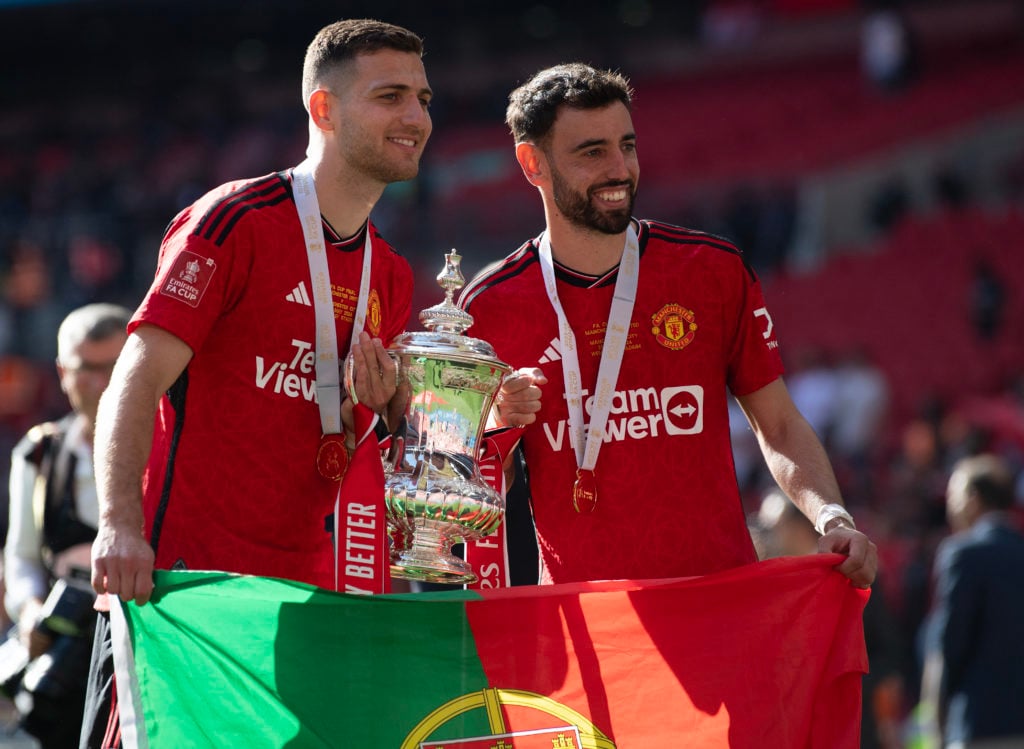 Diogo Dalot (left) and Bruno Fernandes of Manchester United celebrate winning the Emirates FA Cup Final match between Manchester City and Mancheste...