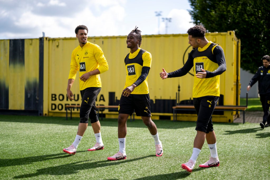 Felix Nmecha, Jamie Bynoe-Gittens and Jadon Sancho of Borussia Dortmund during a training session on Open Media Day ahead of their UEFA Champions L...