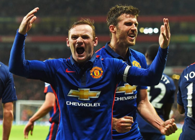 Wayne Rooney of Manchester United celebrates scoring his team's second goal with Michael Carrick of Manchester United during the Barclays Premier L...