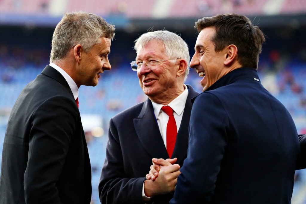 Sir Alex Ferguson talks with Manager of Manchester United Ole Gunnar Solskjaer and Gary Neville before the UEFA Champions League Quarter Final seco...