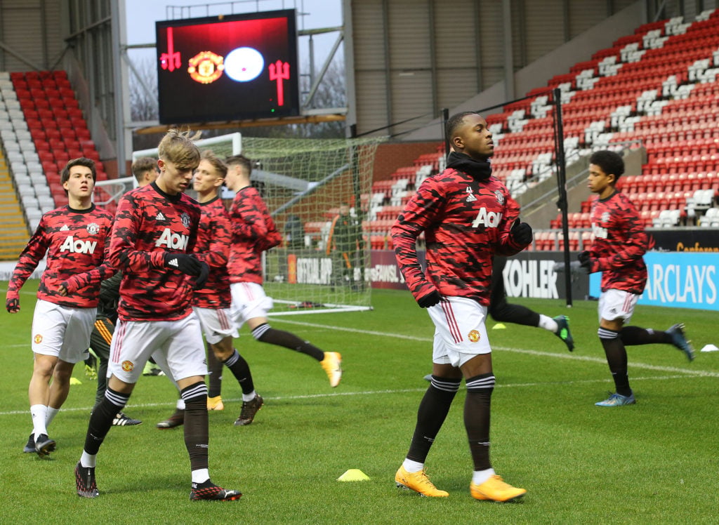 Facundo Pellistri, Brandon Williams, Ethan Laird of Manchester United U23s in action during the Premier League 2 match between Manchester United U23s and Manchester City U23s at Leigh Sports Village on December 13, 2020