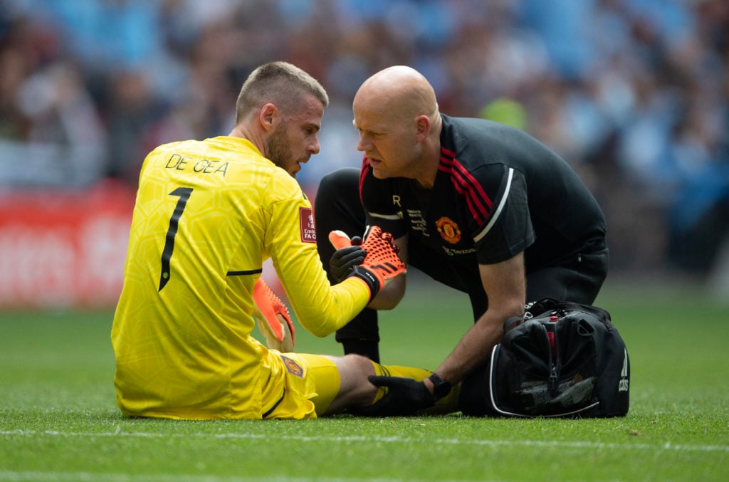 David de Gea of Manchester United receives attention from Utd medical staff during the Emirates FA Cup Final between Manchester City and Manchester...