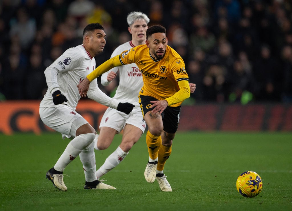 Matheus Cunha of Wolverhampton Wanderers in action with Casemiro and Alejandro Garnacho of Manchester United during the Premier League match betwee...