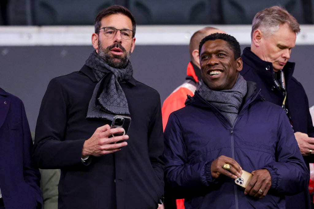 Ruud van Nistelrooy talks to Clarence Seedorf during the friendly match between Germany and Netherlands at Deutsche Bank Park on March 26, 2024 in ...