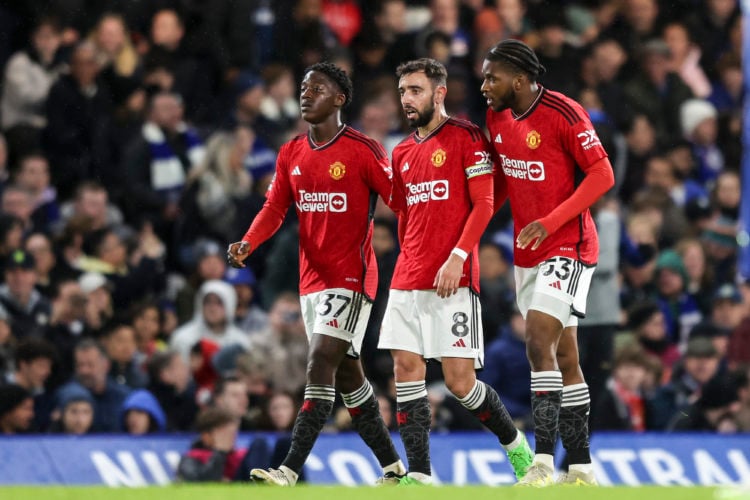 Kobbie Mainoo, Bruno Fernandes and Willy Kambwala  of Manchester United during the Premier League match between Chelsea FC and Manchester United at...