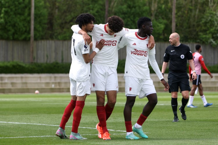 Ethan Wheatley of Manchester United U21s celebrates with Omari Forson and Ethan Williams after he scores his and the teams second goal of the gamed...