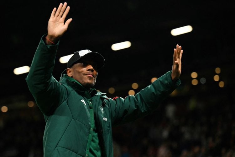 Manchester United's French striker #09 Anthony Martial thanks the supporters at the end of the English Premier League football match between Manche...