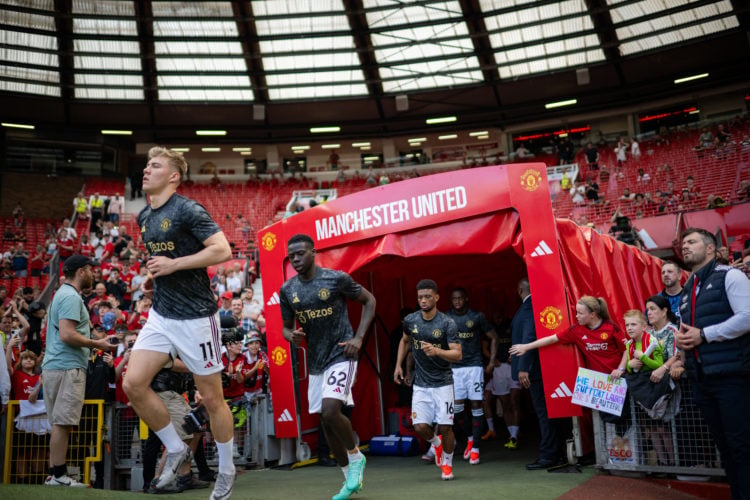 Rasmus Hojlund, Omari Forson, Amad and Aaron Wan-Bissaka of Manchester United warm up ahead of the Premier League match between Manchester United a...