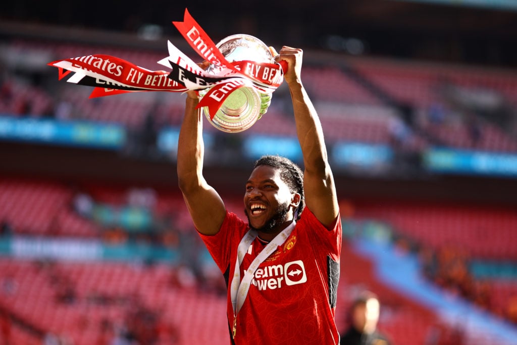 Willy Kambwala of Manchester United celebrates with the Emirates FA Cup Trophy after his team's victory after the Emirates FA Cup Final match betwe...