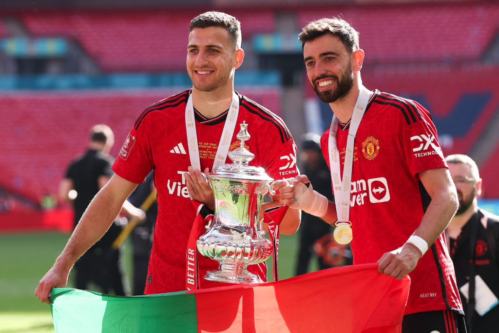 Diogo Dalot and Bruno Fernandes  of Manchester United celebrate with the FA Cup trophy after the Emirates FA Cup Final match between Manchester Cit...