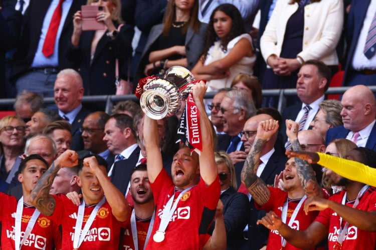 Christian Eriksen of Manchester United lifts the trophy among team mates during the Emirates FA Cup Final match between Manchester City and Manches...