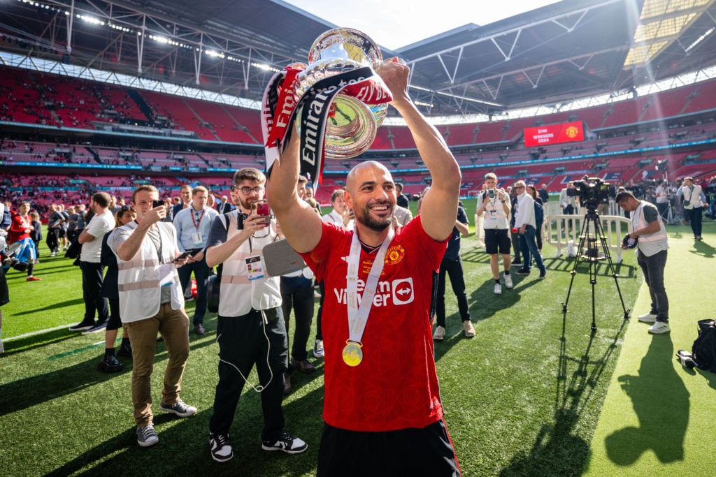 Sofyan Amrabat of Manchester United celebrates with the Emirates FA Cup trophy after winning the Emirates FA Cup Final match between Manchester Cit...
