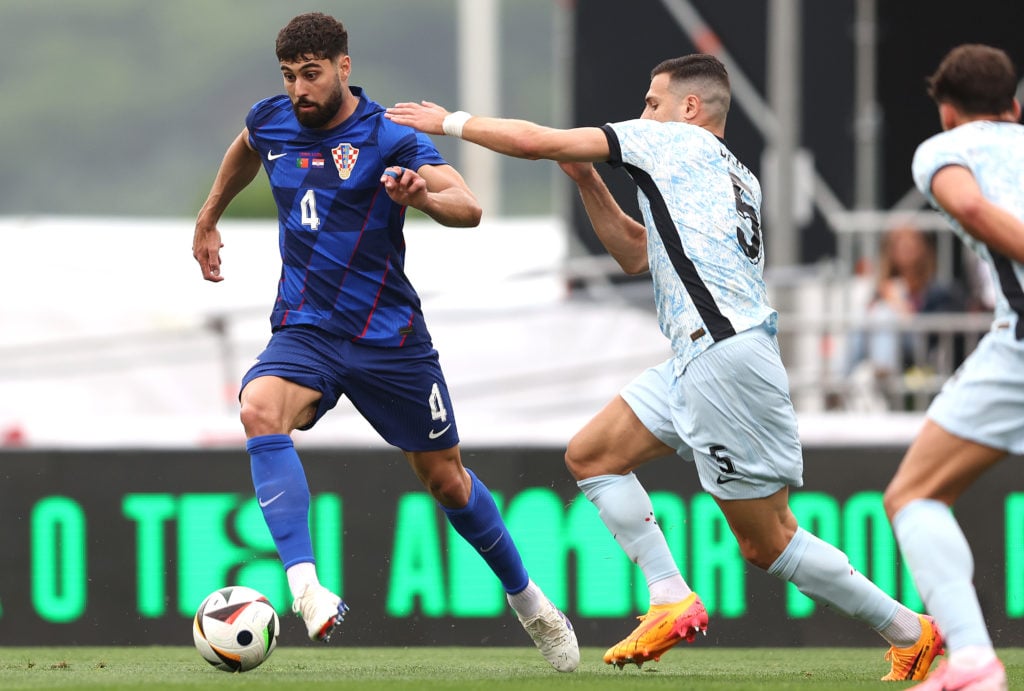 Josko Gvardiol of Croatia is challenged by Diogo Dalot of Portugal during International Friendly match between Portugal and Croatia at Estadio Naci...