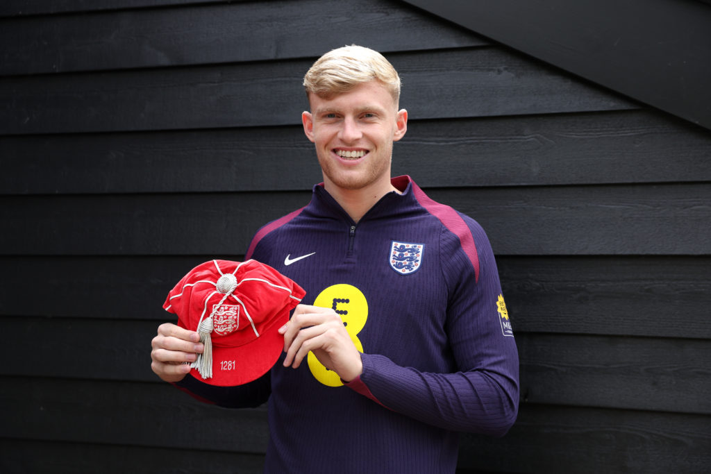 Jarrad Branthwaite of England poses for a photo with his Legacy Cap, after making his England debut against Bosnia & Herzegovina, at Spurs Lodg...