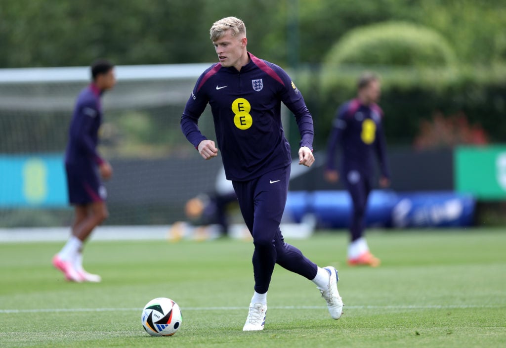 Jarrad Branthwaite of England runs with the ball during a training session at Spurs Lodge on June 05, 2024 in London, England.