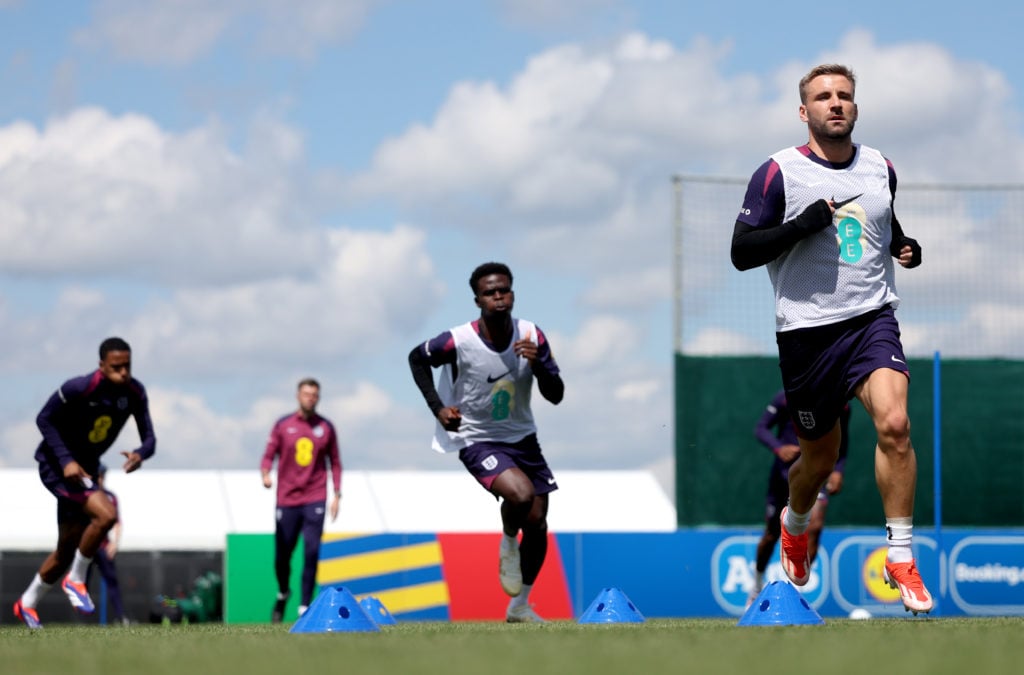 Luke Shaw of England (R) runs during a training session at Spa & Golf Resort Weimarer Land on June 13, 2024 in Blankenhain, Germany.