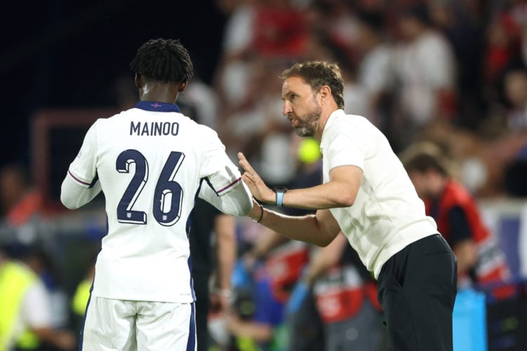 Kobbie Mainoo of England speaks with Gareth Southgate, Head Coach of England,  during the UEFA EURO 2024 group stage match between England and Slov...