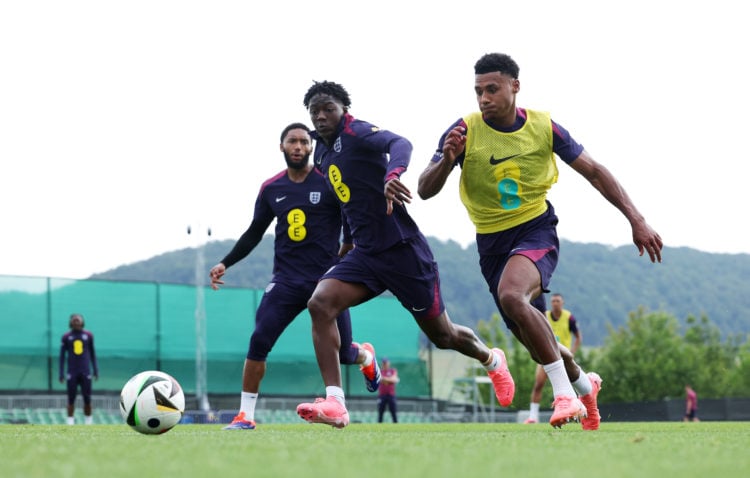 Kobbie Mainoo and Ollie Watkins of England battle for the ball during an England Training Session at Spa & Golf Resort Weimarer Land on June 27...