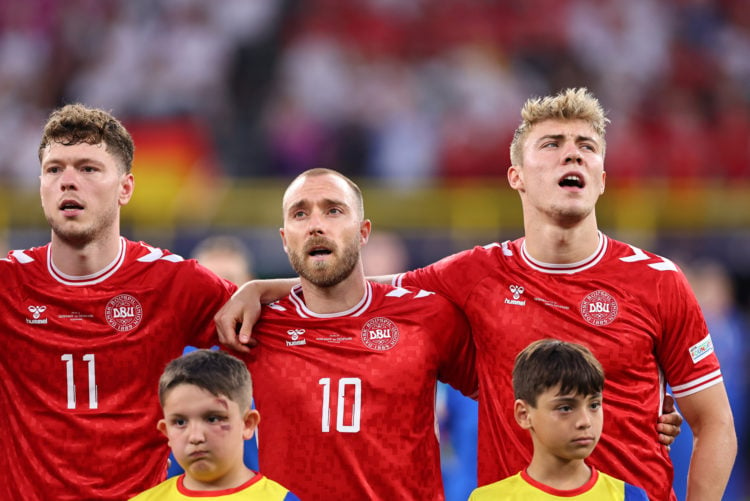 Andreas Skov Olsen, Christian Eriksen and Rasmus Hojlund of Denmark sing the national anthem ahead of  the UEFA EURO 2024 round of 16 match between...